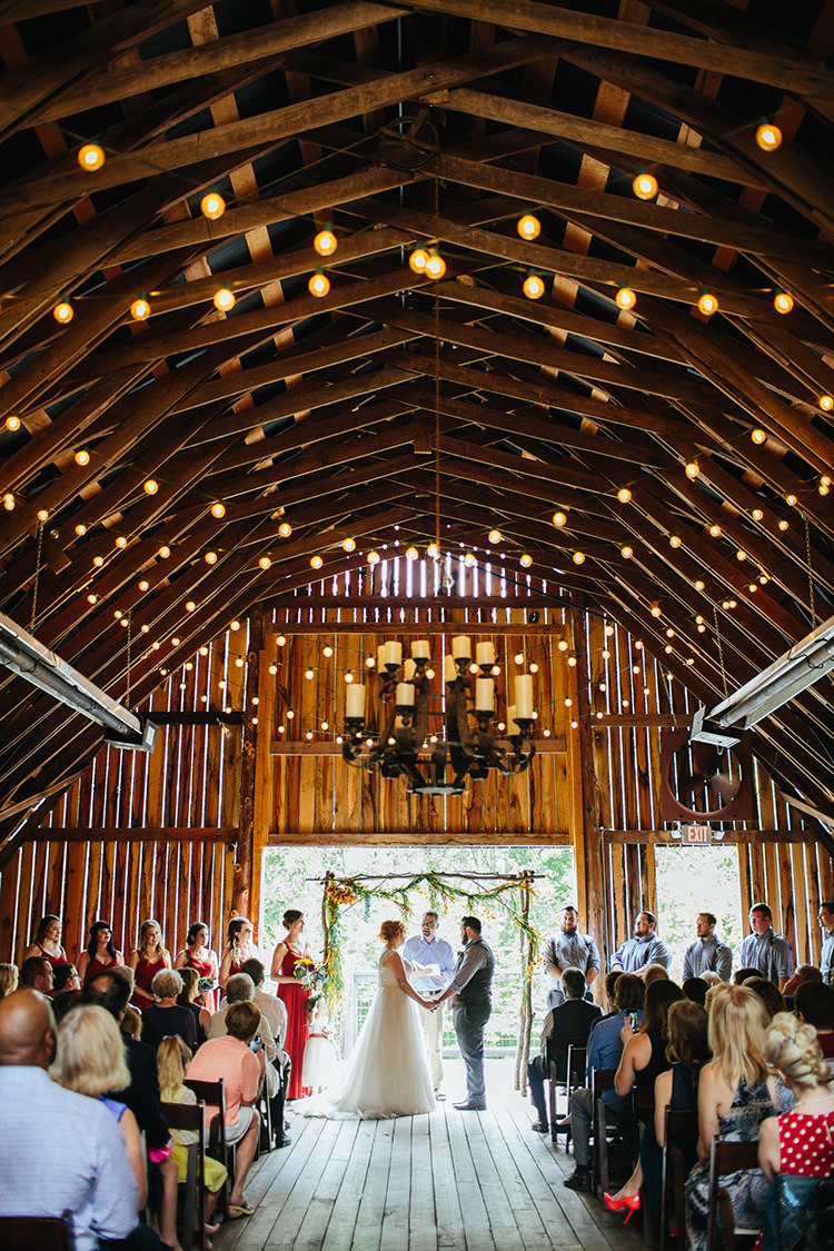 Indoor Barn Ceremony Bride Groom Floral Arch Bridal Party Guests Fairy Lights Candlesticks Creative Quirky Rustic Barn Wedding Tennessee http://www.alexbeephoto.com/