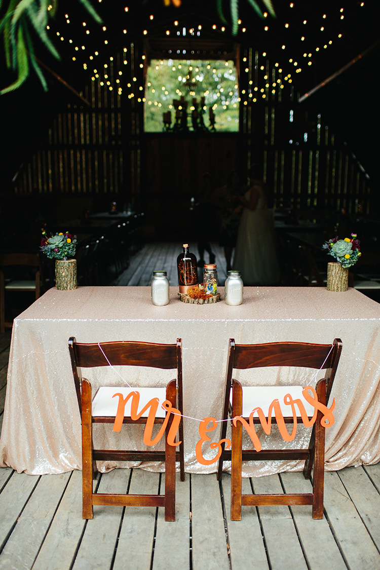 Reception Bride Groom Table Mr Mrs Sign Tree Trunk Vases Multicoloured Flowers Succulents Homemade Centrepiece Hanging Fairy Lights Creative Quirky Rustic Barn Wedding Tennessee http://www.alexbeephoto.com/
