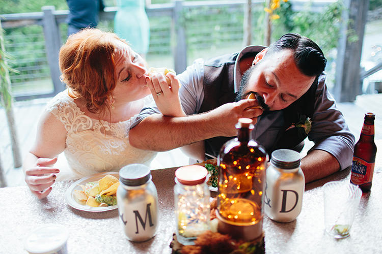 Reception Bride Lace Tulle Bridal Gown Groom Light Grey Shirt Custom Vest Eating Tacos Together Homemade Centrepiece Fairy Lights Personalised Silver Bottles Creative Quirky Rustic Barn Wedding Tennessee http://www.alexbeephoto.com/