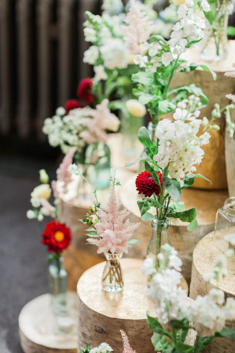 Pink Blue Delicate Pretty Flowers Astilbe Summer Log Red Dahlia Bottles Beautifully Romantic Eclectic Tipi Wedding http://www.jobradbury.co.uk/