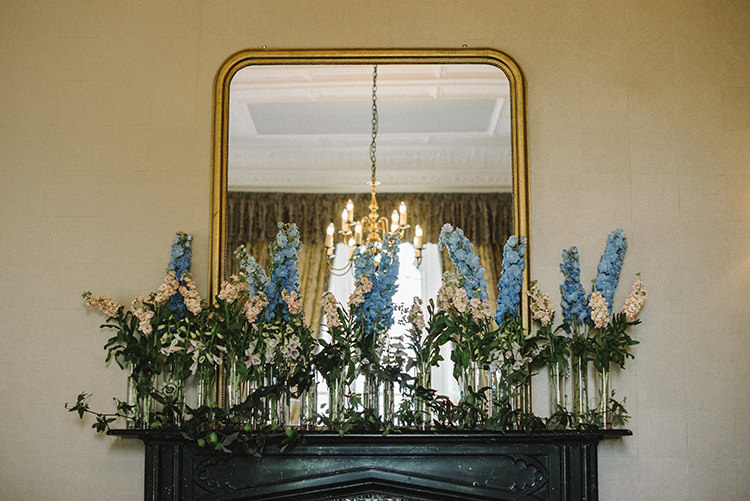 Pink Blue Flowers Floral Stocks Greenery Fireplace Tall Narrow Vases Scenic Outdoor Loch Lomond Wedding http://www.lisadevinephotography.co.uk/