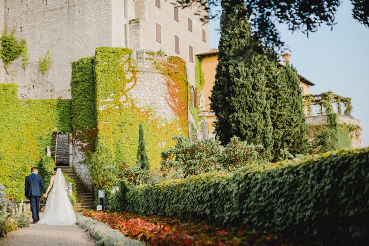 Castle Walls Holding Hands Romantic Vibrant Pink Wedding Trieste http://www.emotionttl.com/en/home/