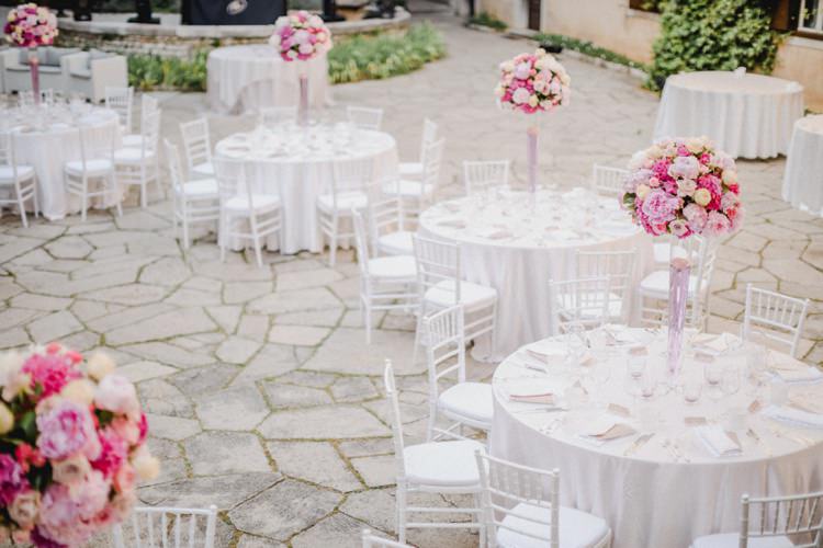 Tall Centre Pieces White Linen Tables Chairs Romantic Vibrant Pink Wedding Trieste http://www.emotionttl.com/en/home/