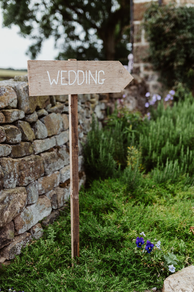 Rustic Wooden Sign Post Painted White Beautifully Relaxed Outdoorsy Barn Wedding http://www.caitlinandjones.co.uk/
