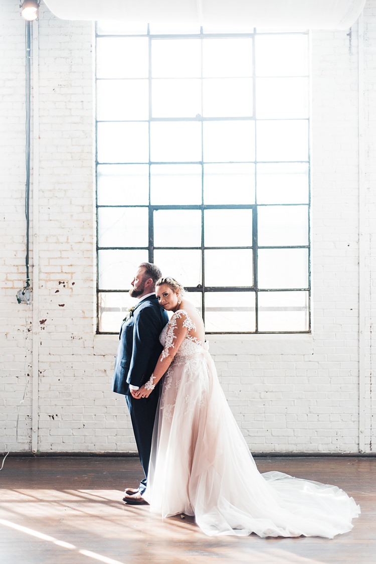 Lace Sleeves Bride Groom Close Romantic Industrial Studio Loft Georgia Wedding http://krisandraevans.com/