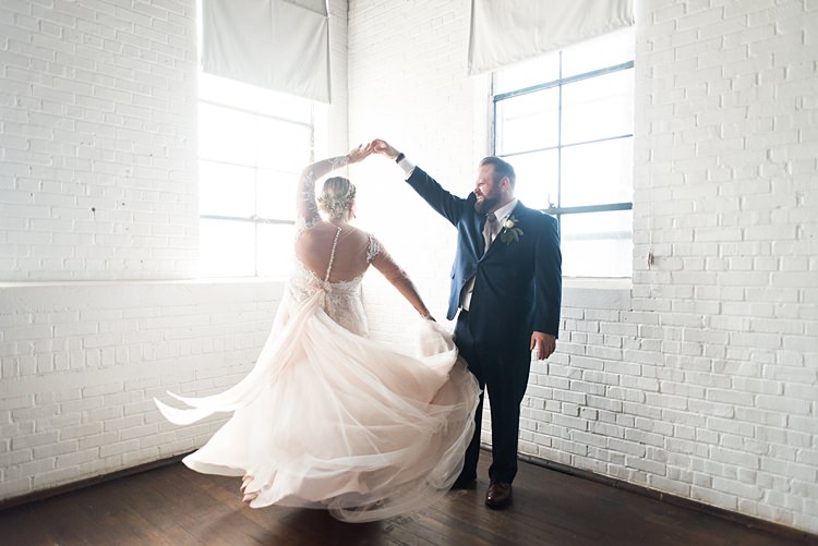 Bride Groom Twirl Spin Dress Romantic Industrial Studio Loft Georgia Wedding http://krisandraevans.com/