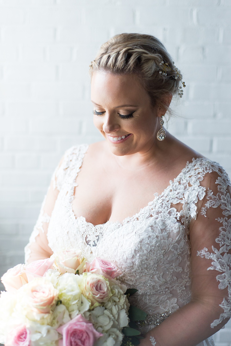 Bride Lace Sleeves Detail Bouquet Romantic Industrial Studio Loft Georgia Wedding http://krisandraevans.com/ 
