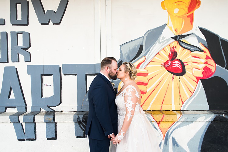 Art Poster Kiss Bride Groom Romantic Industrial Studio Loft Georgia Wedding http://krisandraevans.com/