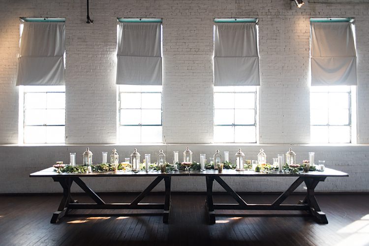 Lanterns Candles Greenery Table Romantic Industrial Studio Loft Georgia Wedding http://krisandraevans.com/