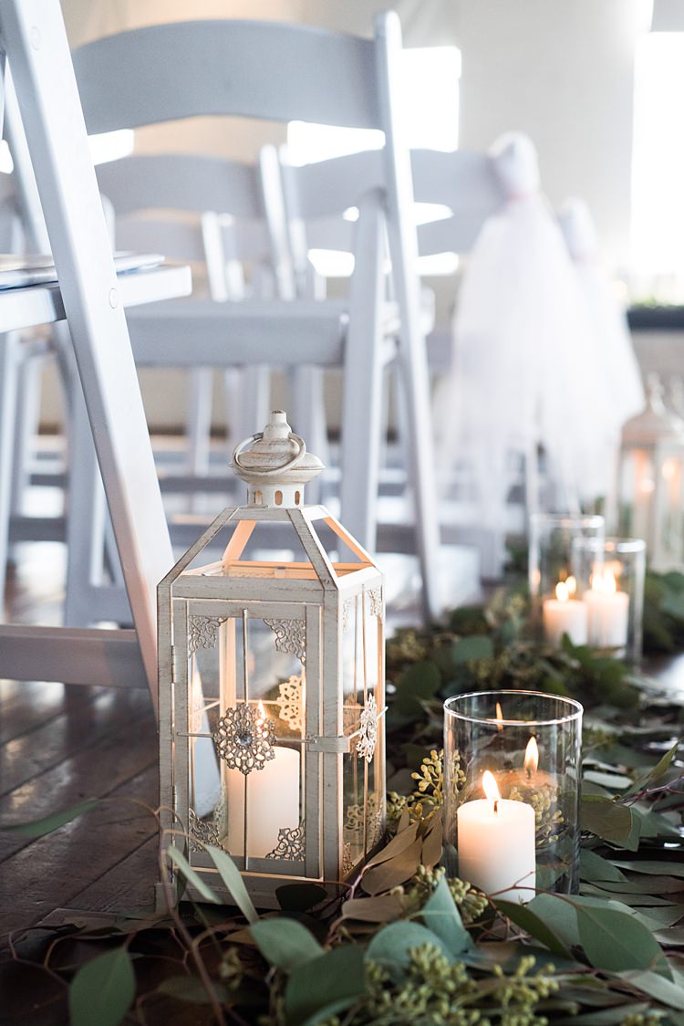 Aisle Lanterns Candles Greenery Romantic Industrial Studio Loft Georgia Wedding http://krisandraevans.com/ 
