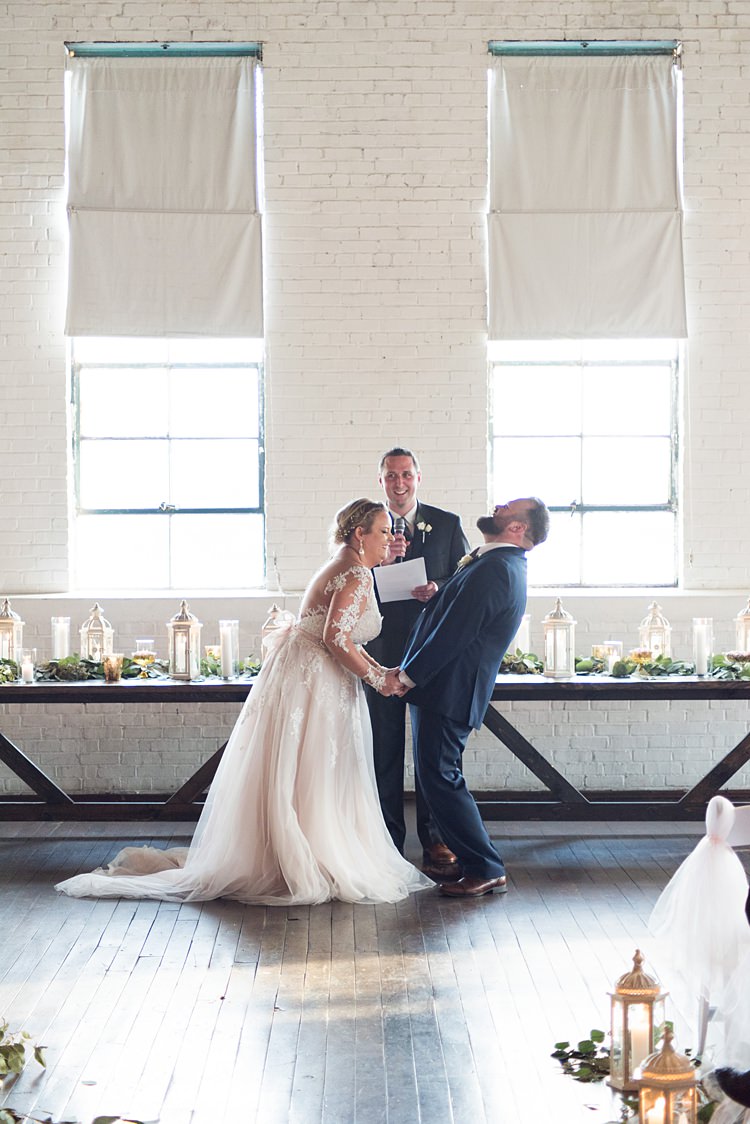 Bride Groom Laughter Ceremony Romantic Industrial Studio Loft Georgia Wedding http://krisandraevans.com/