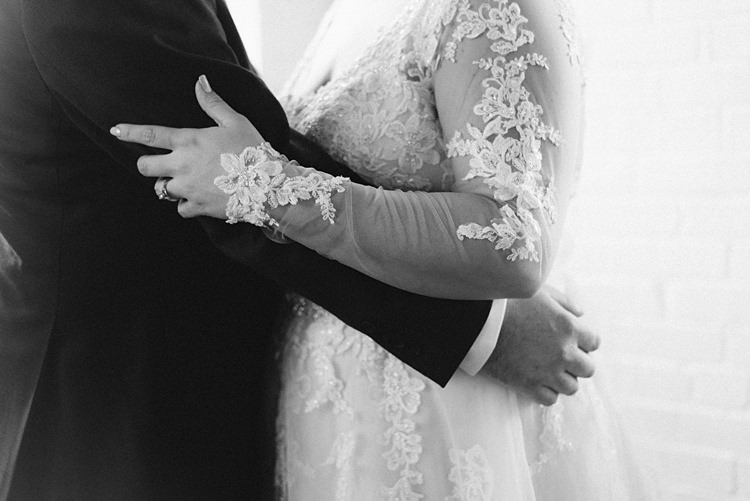 Bride Groom Embrace Lace Romantic Industrial Studio Loft Georgia Wedding http://krisandraevans.com/