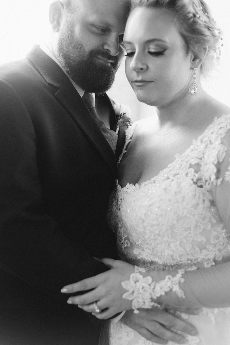 Bride Groom Embrace Close Lace Dress Romantic Industrial Studio Loft Georgia Wedding http://krisandraevans.com/