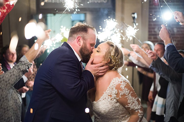 Kiss Bride Groom Sparklers Romantic Industrial Studio Loft Georgia Wedding http://krisandraevans.com/ 