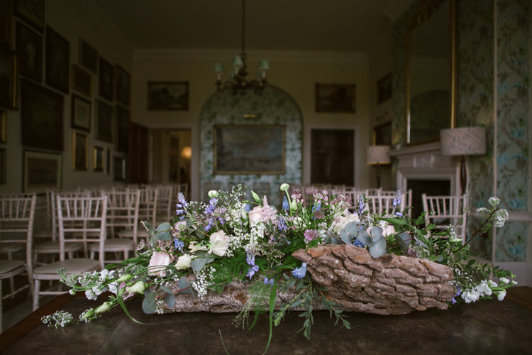 Table Flower Arrangement Floral Log Greenery Pastel Floral Easter Spring Woodland Wedding http://emmastonerweddings.com/