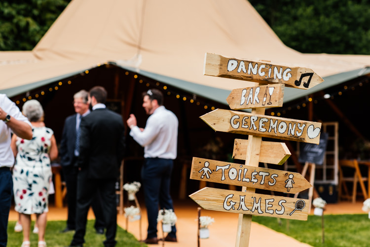 Wooden Rustic Painted Sign Post Fun Loving Secret Garden Tipi Wedding https://www.aaroncollettphotography.co.uk/