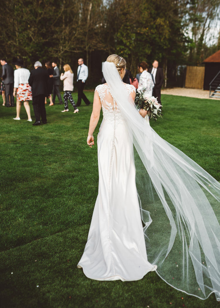 Bride Bridal Justin Alexander Gown Dress Button Back Detail Cathedral Veil Embroidery Elegant Unique Pale Pink Tipi Wedding http://holliecarlinphotography.com/