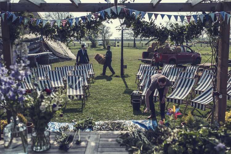 Ceremony Deck Chairs Bunting Arch Greenery Foliage Garland Floral Quirky Seaside Farm Wedding http://www.thomasthomasphotography.co.uk/