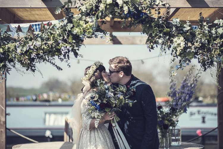 Ceremony Arch Garland Greenery Foliage Floral Bunting Kula Tsurdiu Bride Bridal Dress Waxflower Flower Crown Blue Bouquet Veil Next Groom Quirky Seaside Farm Wedding http://www.thomasthomasphotography.co.uk/