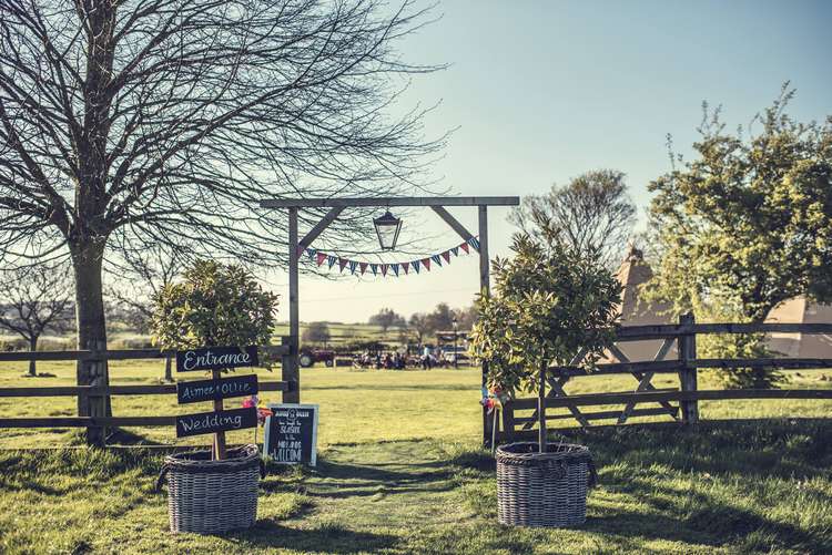 Wedding Entrance Archway Bunting Bay Trees Sign Quirky Seaside Farm Wedding http://www.thomasthomasphotography.co.uk/