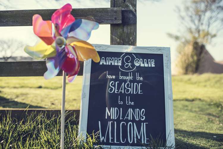 Welcome Sign Chalkboard Frame Pinwheel Quirky Seaside Farm Wedding http://www.thomasthomasphotography.co.uk/