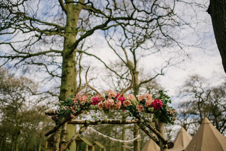 Floral Pink Antler Archway Wood Flower Garland Magical Cosy Forest Tipi Wedding http://katewatersphotography.com/