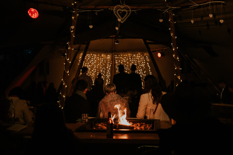 Fire Pit Fairy Lights Pea Lights Magical Cosy Forest Tipi Wedding http://katewatersphotography.com/