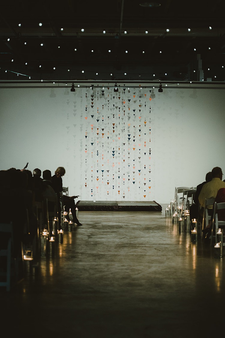 Geometric Hanging Paper Triangle Backdrop Ceremony Hip Art Gallery Wedding Colorado http://www.lisarundallphotography.com/