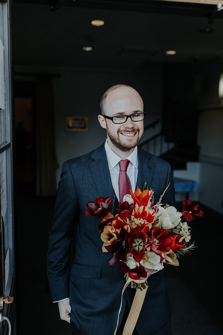 Groom Bouquet Tulips Red White Ribbon Flowers All The Colours Quirky Dinosaur Wedding https://leahlombardi.com/