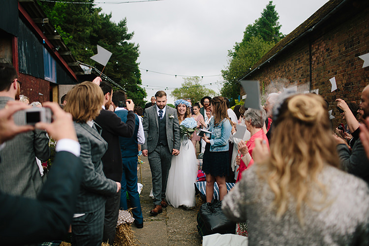Flags Confetti Aisle Ceremony Festoon Lights Indie Outdoorsy Cowshed DIY Wedding http://www.danhoughphoto.com/