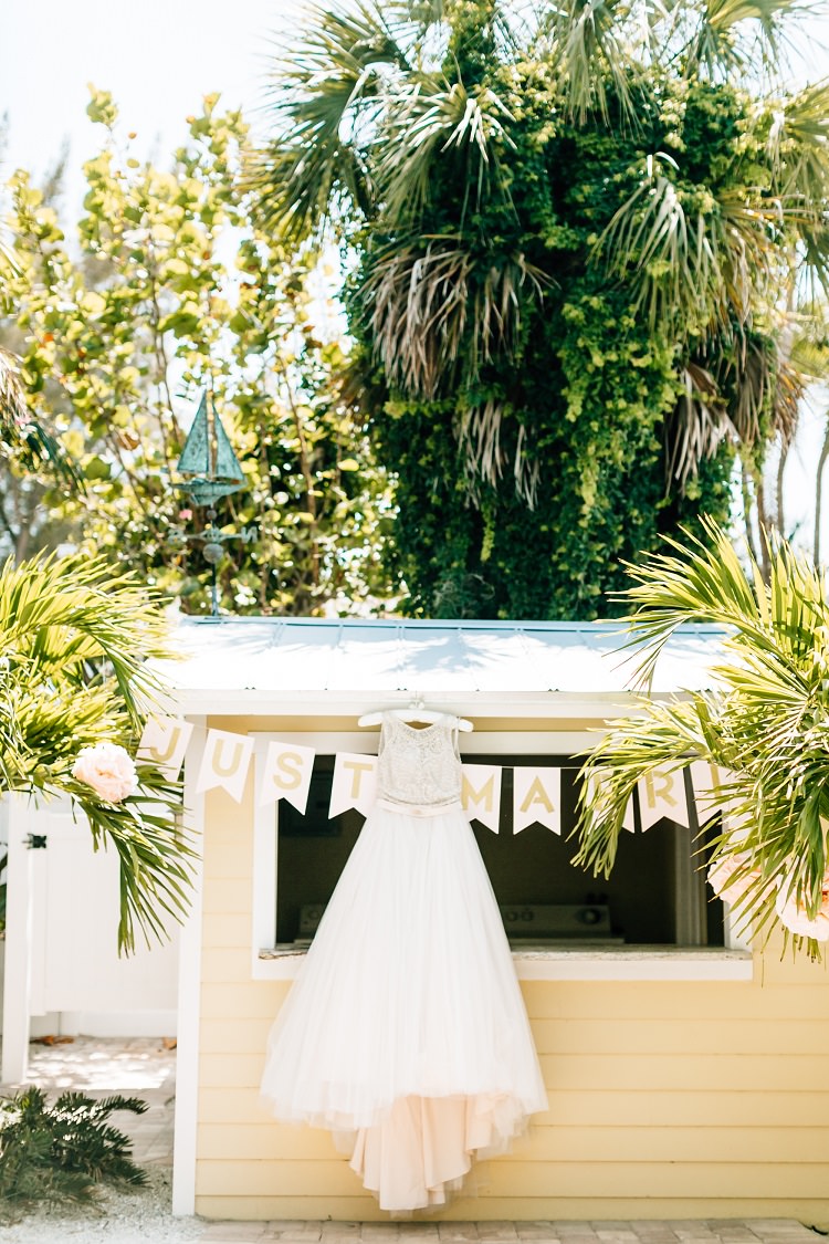 Bride Bridal Dress Gown Madison James Embellished Just Married Bunting Flags Pink Gold Flamingos Pineapples Florida Destination Wedding http://www.findinglightphotography.com/