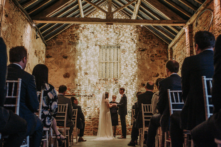 Fairy Lights Ceremony Rustic Charm Contemporary Pastel Barn Wedding http://www.bloomweddings.co.uk/