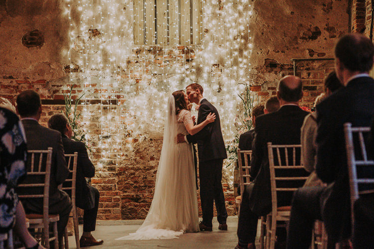 Fairy Lights Ceremony Rustic Charm Contemporary Pastel Barn Wedding http://www.bloomweddings.co.uk/