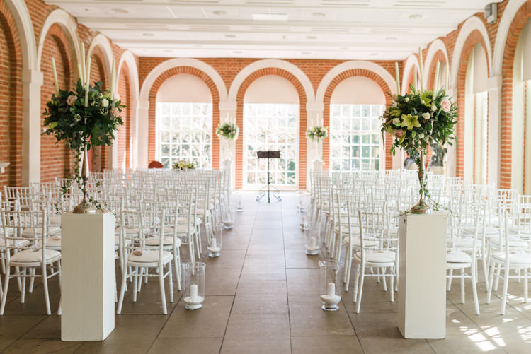 Great Fosters Ceremony Set Up White Pedestal White Chiavari Chairs Candles Classic Spring Cherry Blossom Wedding http://www.hannahmcclunephotography.com/