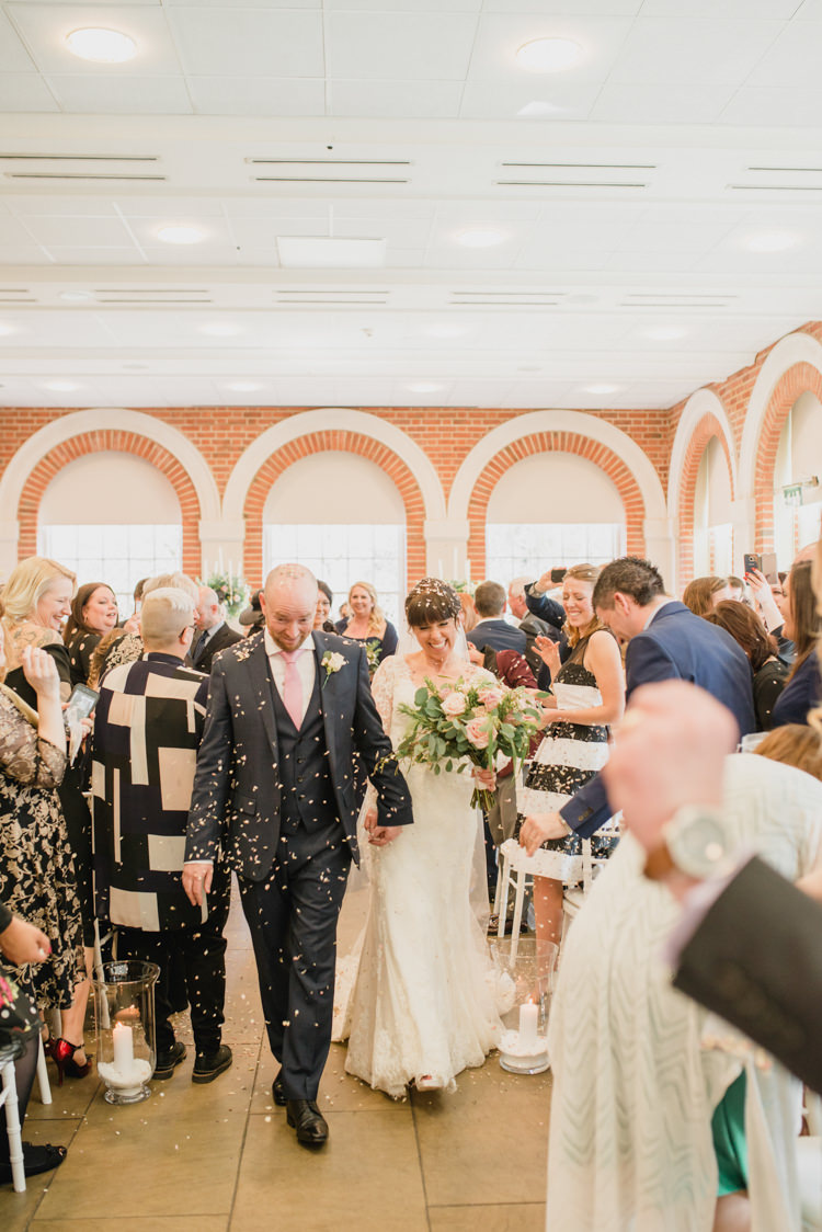 Confetti Shot Bride Bridal Essense of Australia Gown Dress Long Sleeves Veil Bouquet Eucalptus Rose Blush Pink Hugo Boss Groom Classic Spring Cherry Blossom Wedding http://www.hannahmcclunephotography.com/
