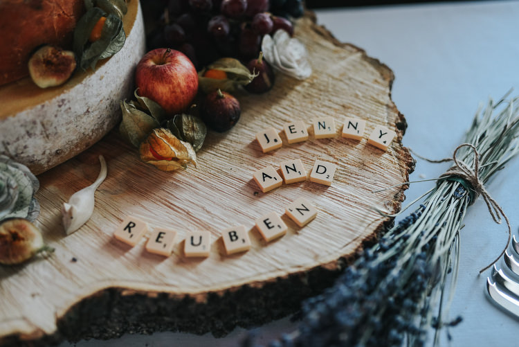 Log Scrabble Decor Cake Stand Crafty Fun Budget Friendly Wedding https://www.pearbearphotography.com/