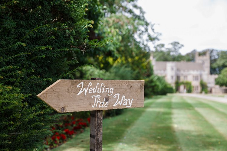 Rustic Painted Wooden Sign Post Graceful Walled Garden Wedding http://helenkingphotography.co.uk/