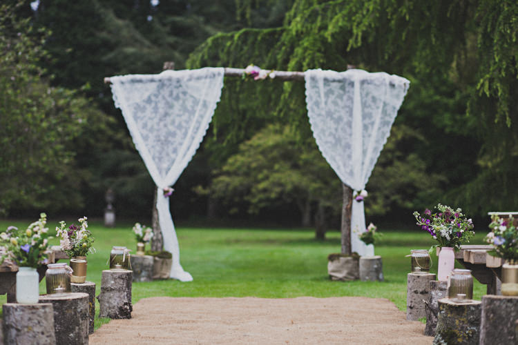 Ceremony Backdrop Aisle Flowers Logs Jars Enchanting Free-Spirited Outdoor Wedding http://www.johnelphinstonestirling.com/