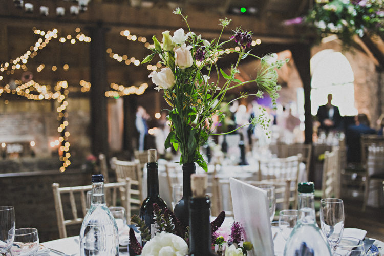 Bottle Flowers Decor Enchanting Free-Spirited Outdoor Wedding http://www.johnelphinstonestirling.com/