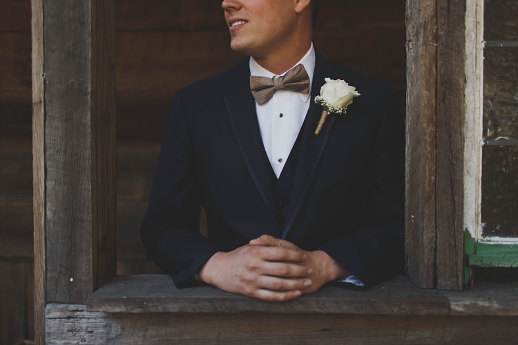 Groom Rose Button Hole Navy Bow Tie Glam Twinkling Ranch Wedding Florida https://www.stacypaulphotography.com/