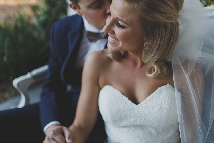 Bride Groom Sitting Kiss Cheek Glam Twinkling Ranch Wedding Florida https://www.stacypaulphotography.com/