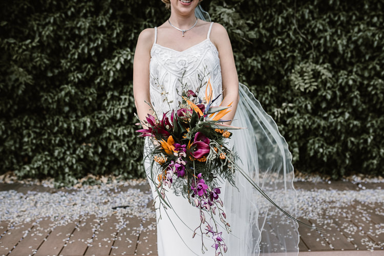 Tropical Bouquet Flowers Bride Bridal Purple Orange Bird Paradise Lily Laid Back Local London Lido Wedding http://andrewbrannanphotography.co.uk/