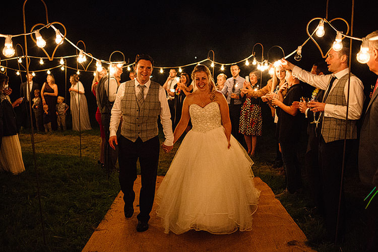 Festoon Lights Exit Bride Groom Charming Natural Countryside Tipi Wedding http://www.pauljosephphotography.co.uk/