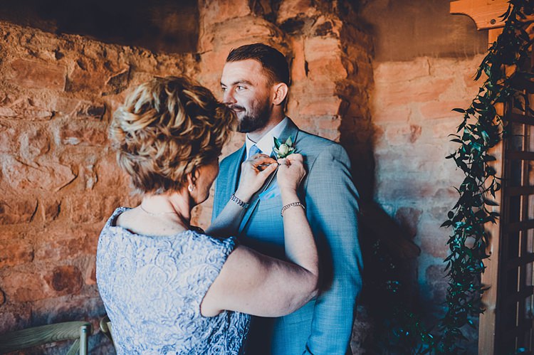 Groom Buttonhole Getting Ready Windy Valley of Fire Wedding Nevada https://cactusandlaceweddings.com/