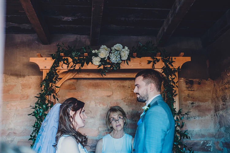 Bride Groom Ceremony Windy Valley of Fire Wedding Nevada https://cactusandlaceweddings.com/