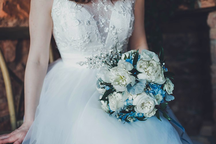 Bride Dress Bouquet Blue Windy Valley of Fire Wedding Nevada https://cactusandlaceweddings.com/