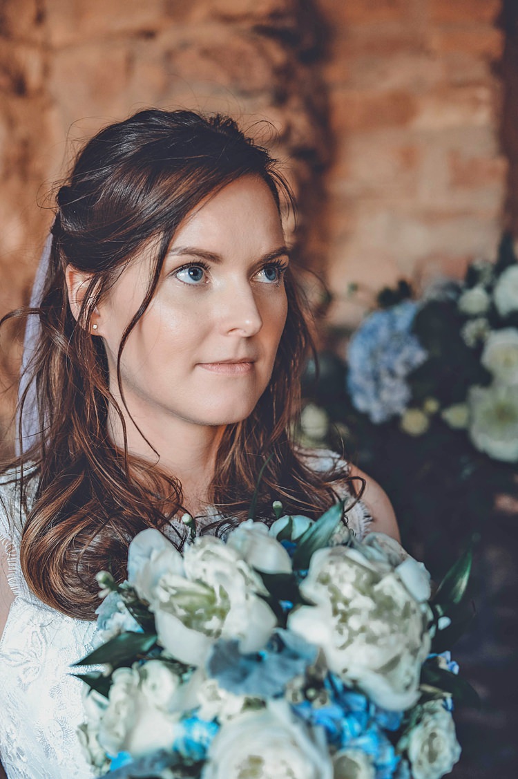 Bride Closeup Windy Valley of Fire Wedding Nevada https://cactusandlaceweddings.com/