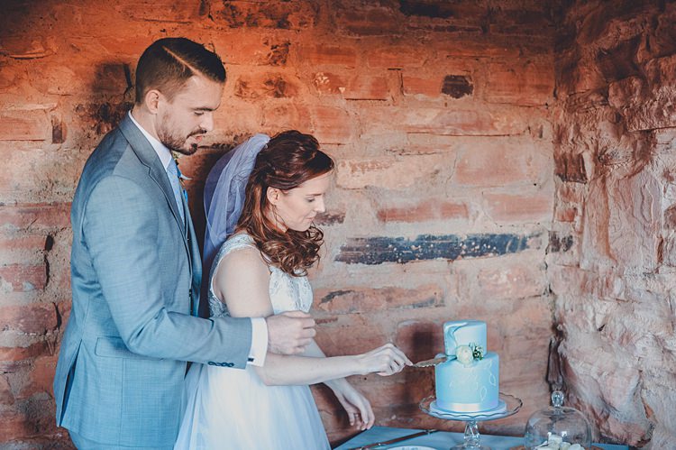 Bride Groom Cake Cutting Windy Valley of Fire Wedding Nevada https://cactusandlaceweddings.com/