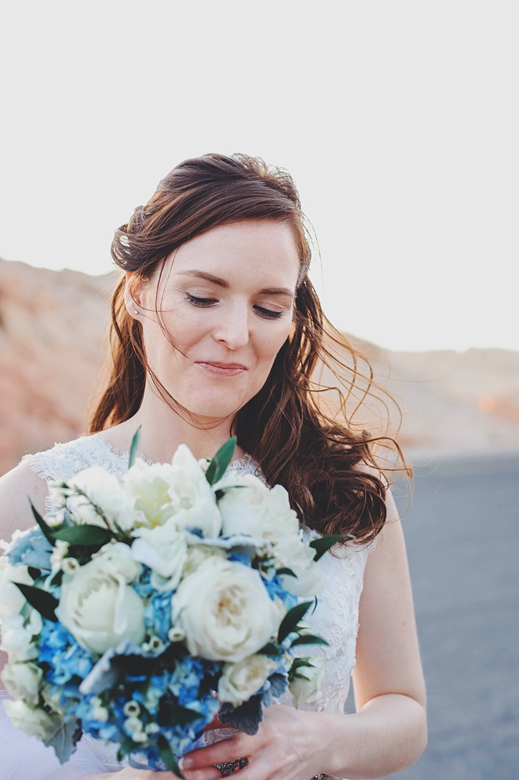 Bride Windswept Windy Valley of Fire Wedding Nevada https://cactusandlaceweddings.com/