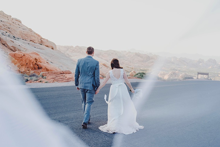 Bride Groom Landscape Windy Valley of Fire Wedding Nevada https://cactusandlaceweddings.com/